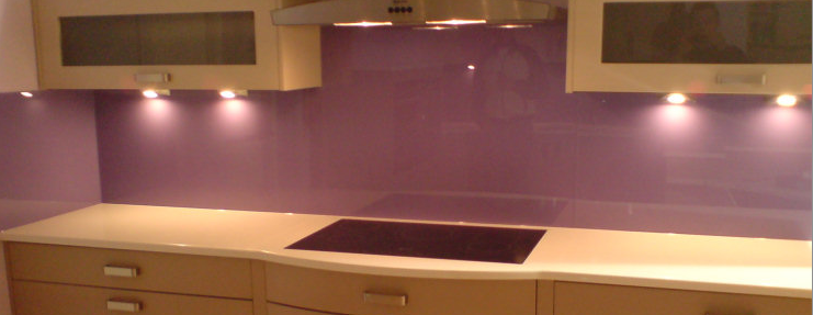 Purple Painted glass kitchen behind the Hob decourative glossy glass splash back