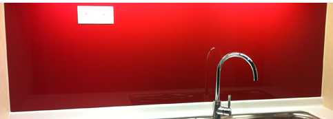 Red glass coloured splash back with glass socket cut out supplied and fitted in derry city and northern ireland