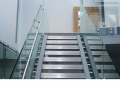 Modern full glass framless staircase and stainless steal fixtures and fittings supplied and installed in ireland.png