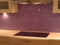 Purple Painted glass kitchen behind the Hob decourative glossy glass splash back.png